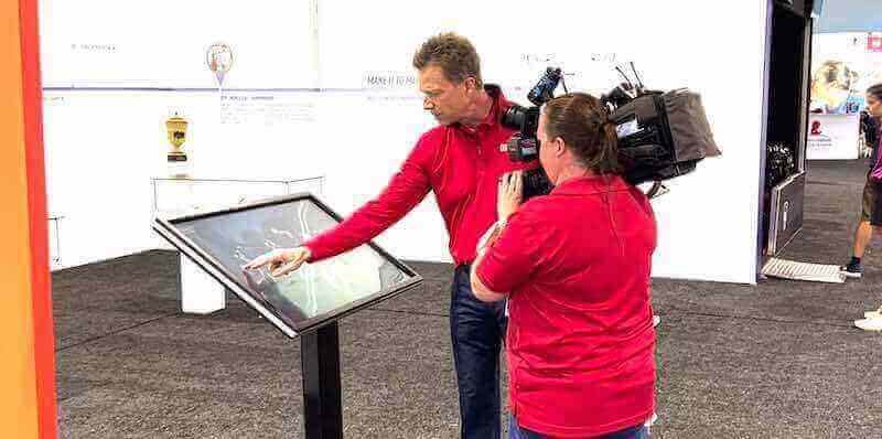 Professional showcasing interactive touchscreen recognition platform Touchscreen interaction at event