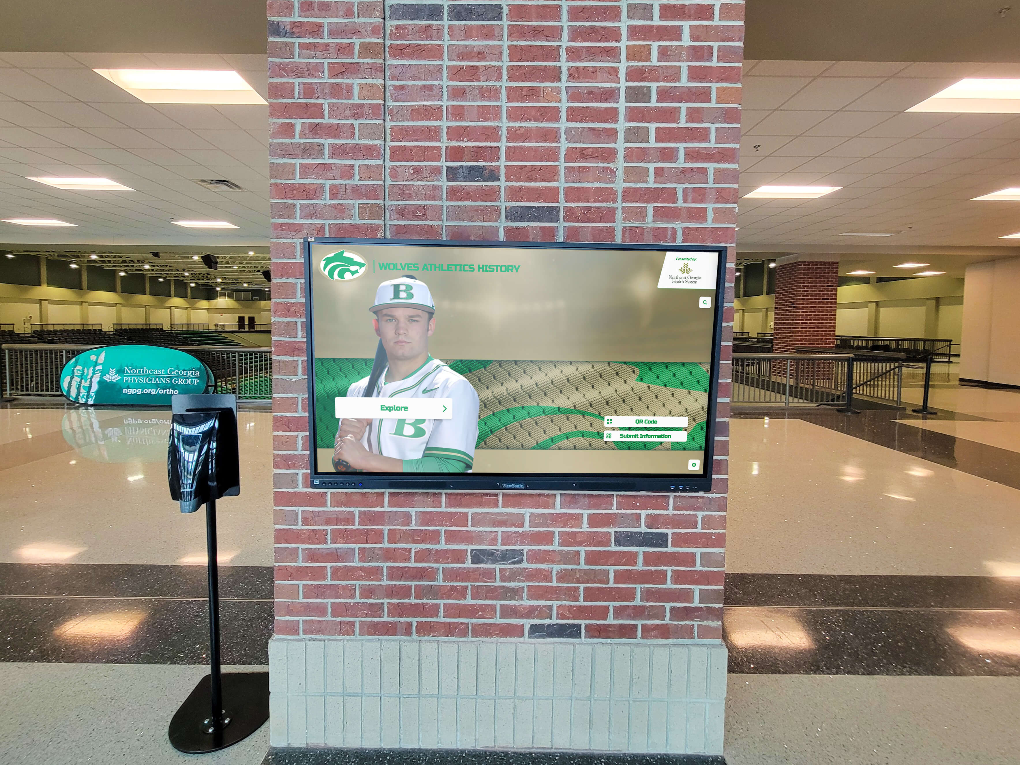 Digital display showing weekly top performers in school athletic facility