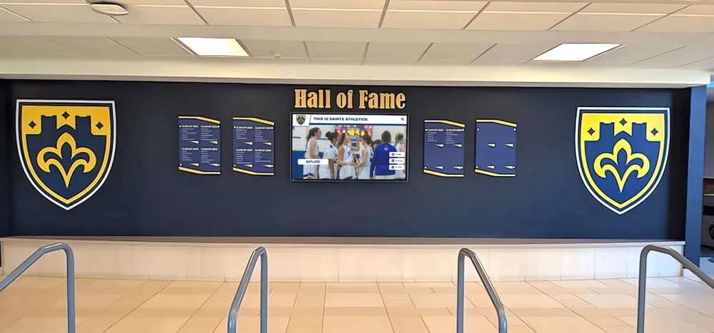School athletic recognition wall displaying soccer achievements