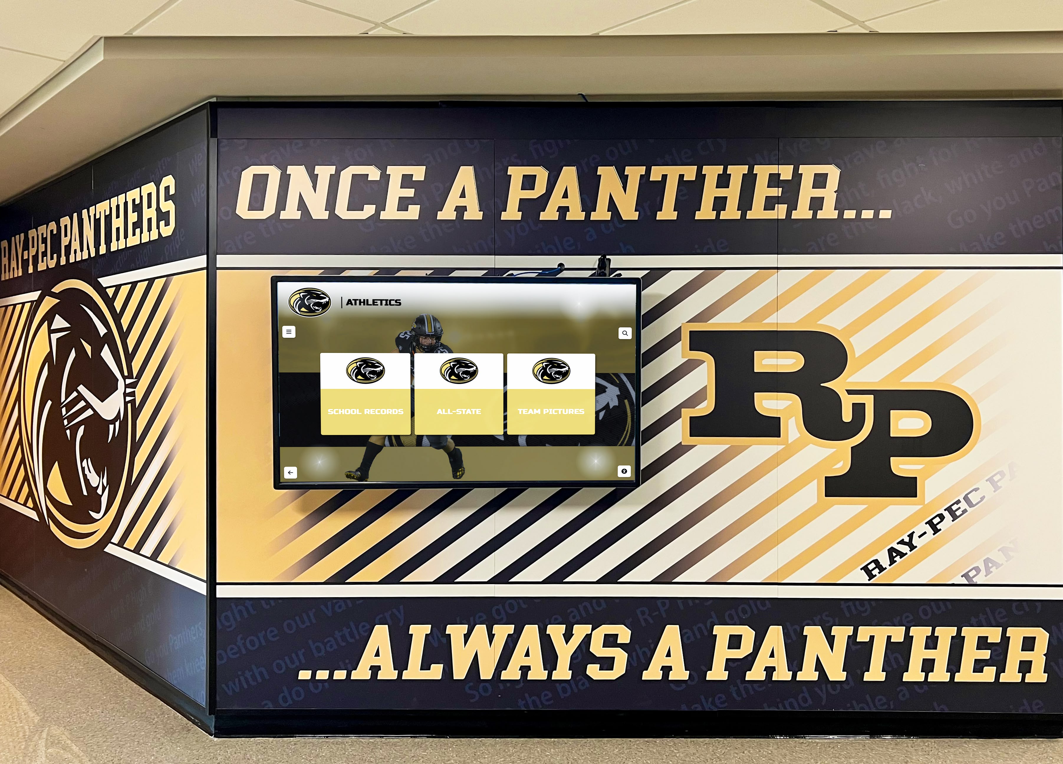 Digital screen display in school athletic hallway